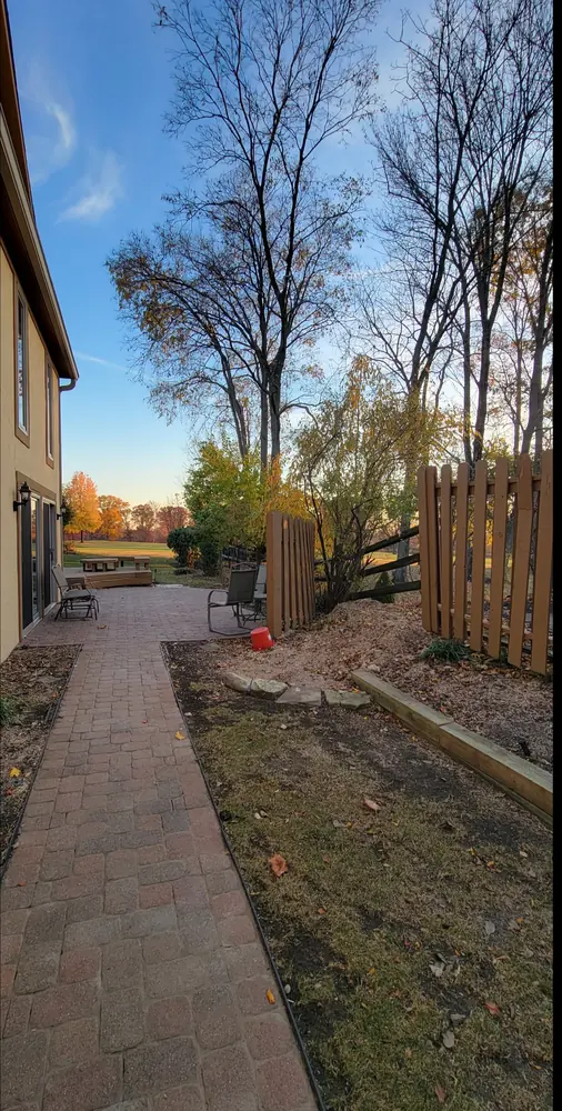 Finished paver walkway running along the side of the house