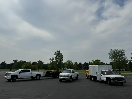 Arbor Pro trucks and chip box lined up before a job
